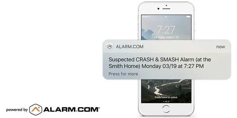 Phone lock screen with Alarm.com notification: Suspected CRASH & SMASH Alarm at the Smith Home